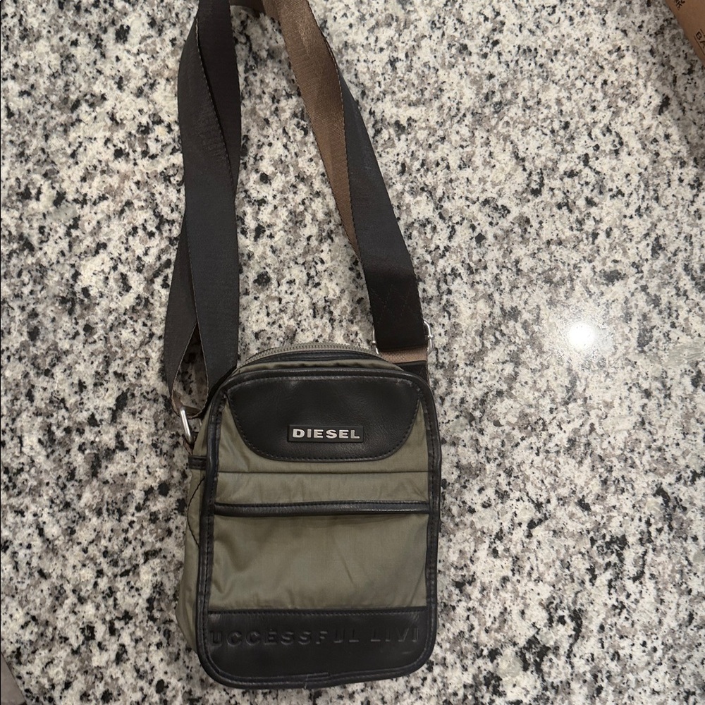 Diesel Men's Army Green and Black Crossbody Bag with adjustable strap.
